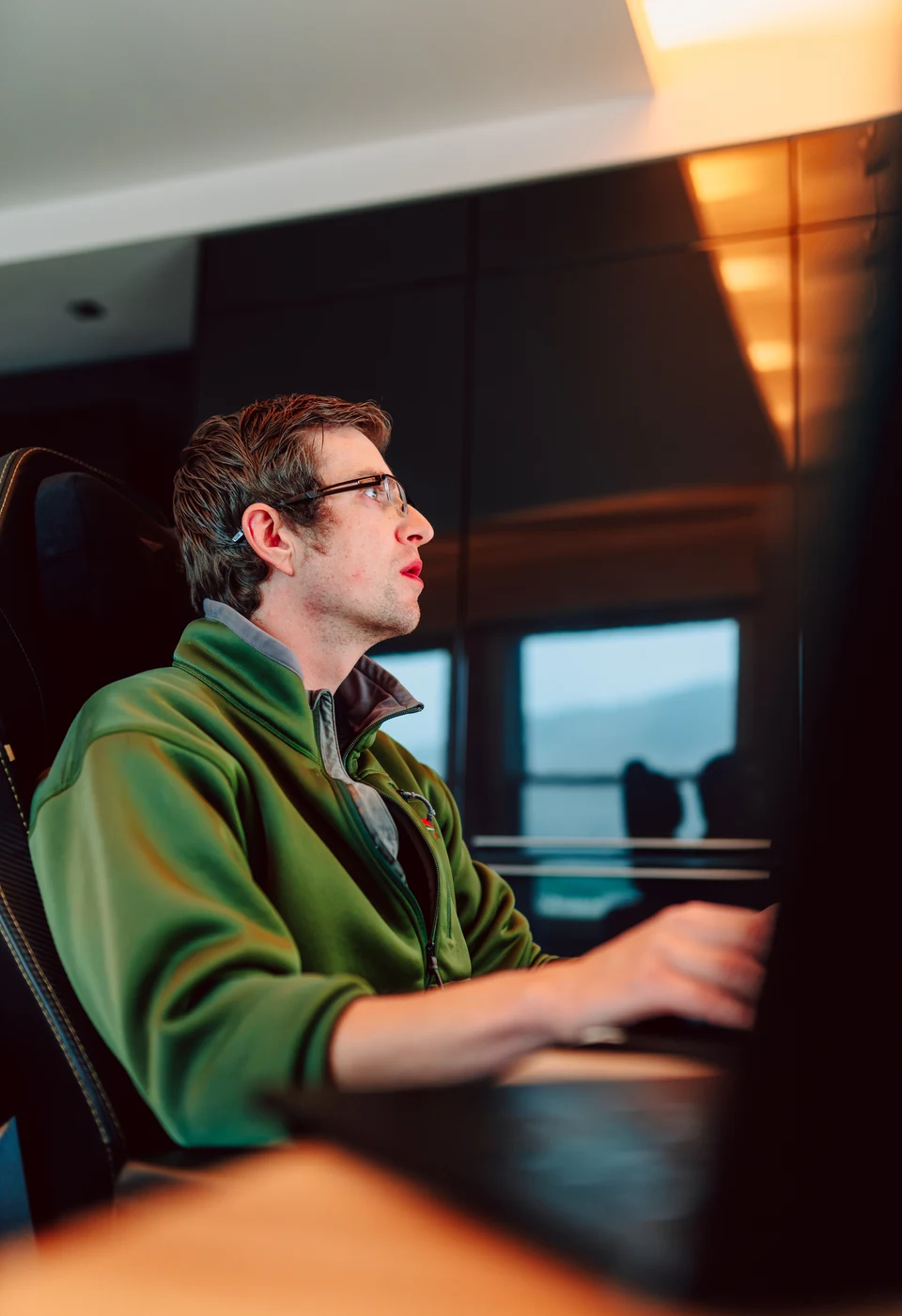 Stick & Tin’s general manager focused on his computer at a desk